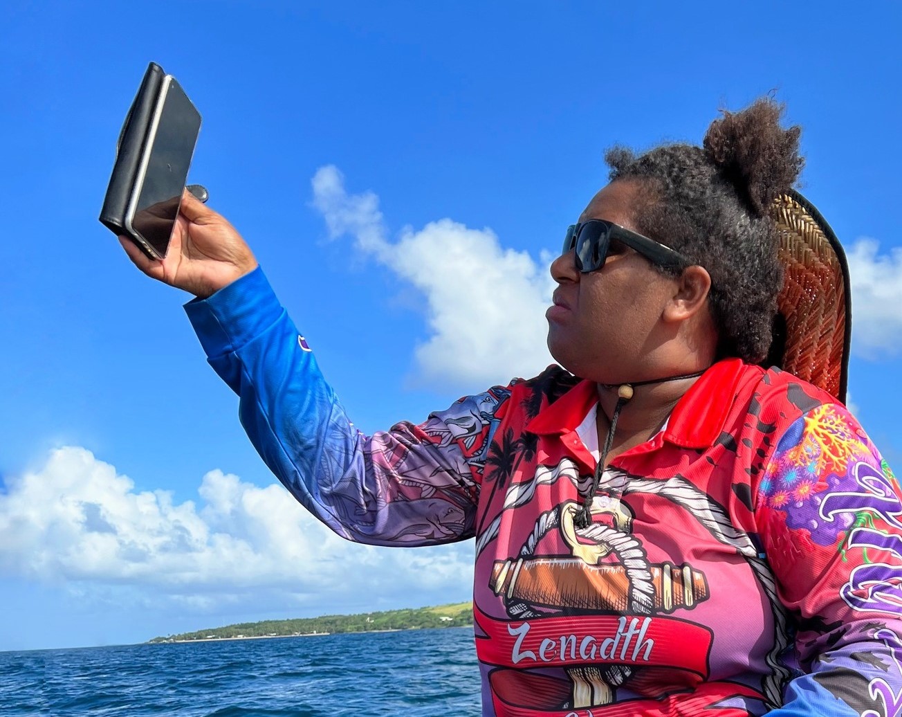 First Nations woman looking at smartphone